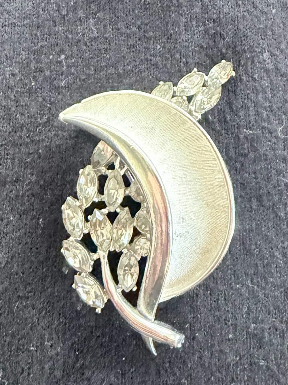 Vintage silver-tone BSK brooch pin with smoky gray rhinestones.